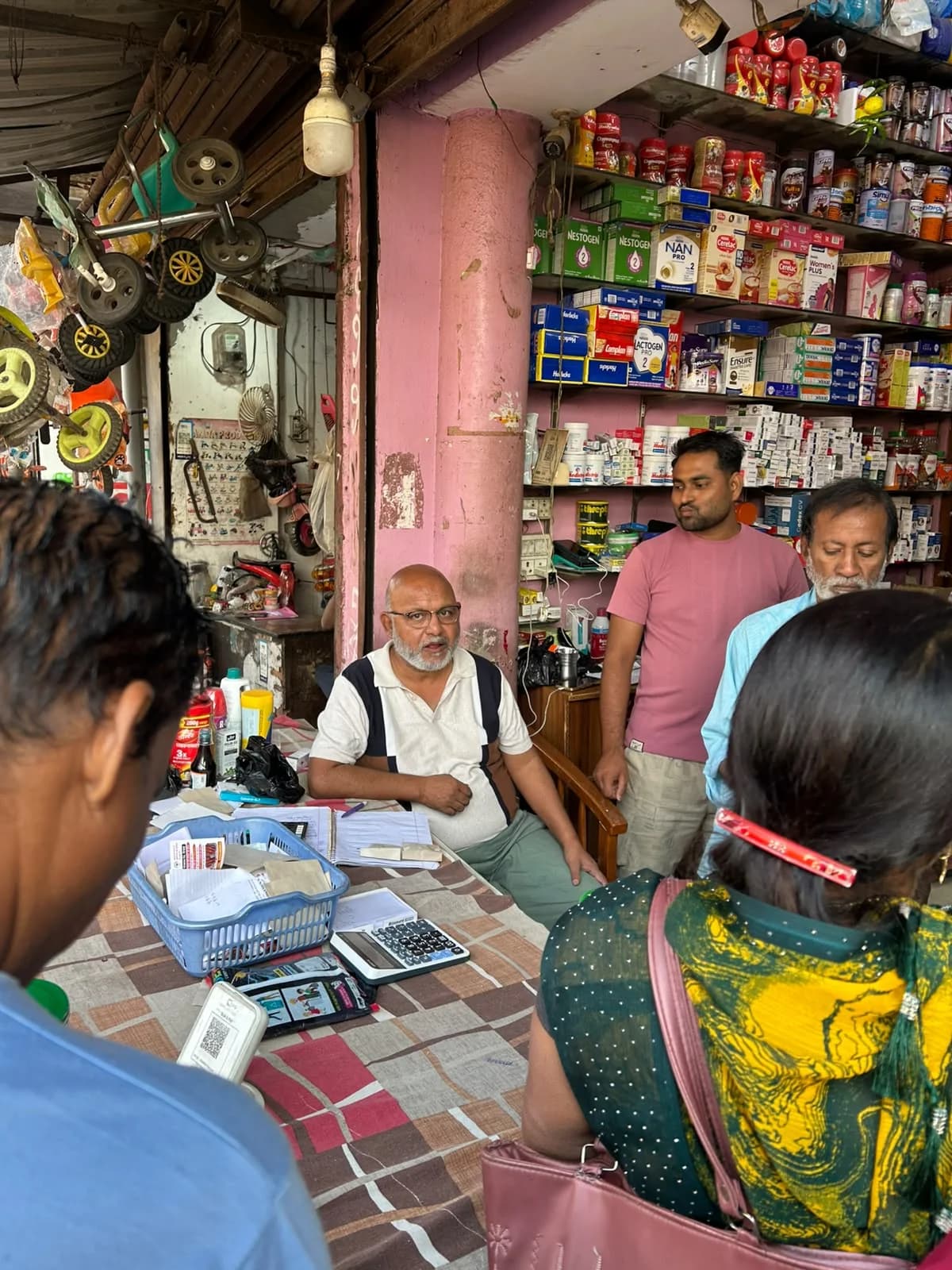 Inside Janta Medical Store – medicine dispensing counter and infant nutrition healthcare shelves in Pipiganj